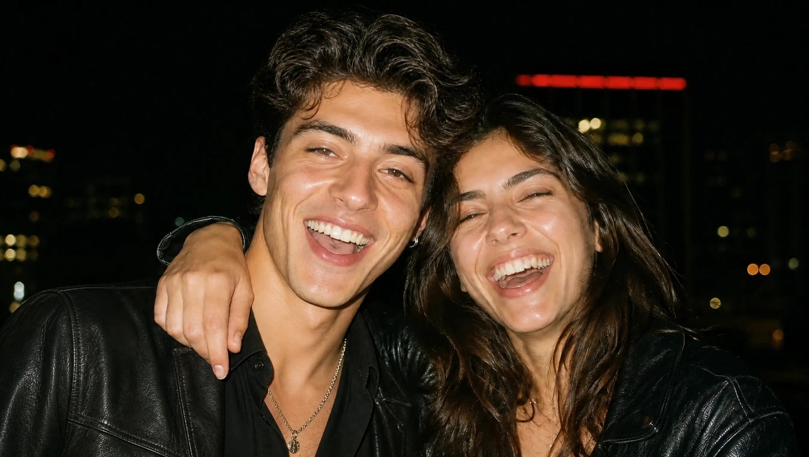 Realistic nighttime photo of two friends laughing together